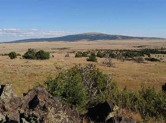 View over plains to a distant mountain